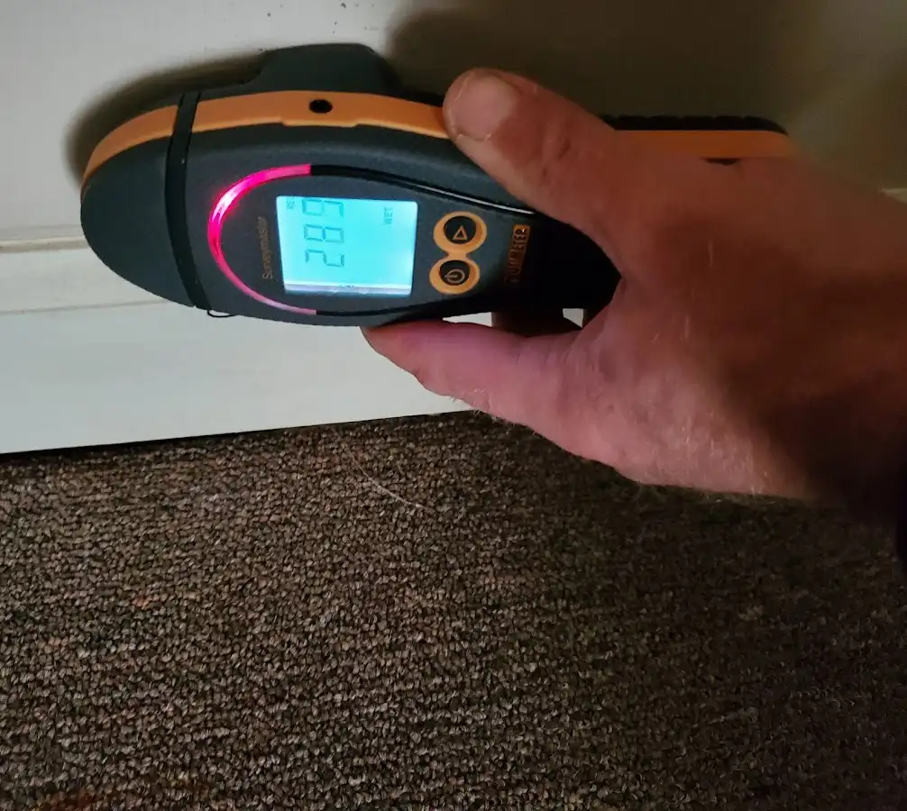 Moisture detection at baseboard during Storm Damage Restoration in Dana Point